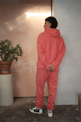 Felpa con cappuccio Fear of God Essentials FW22 color corallo